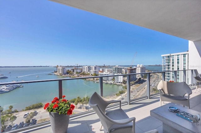 balcony with a city view and a water view