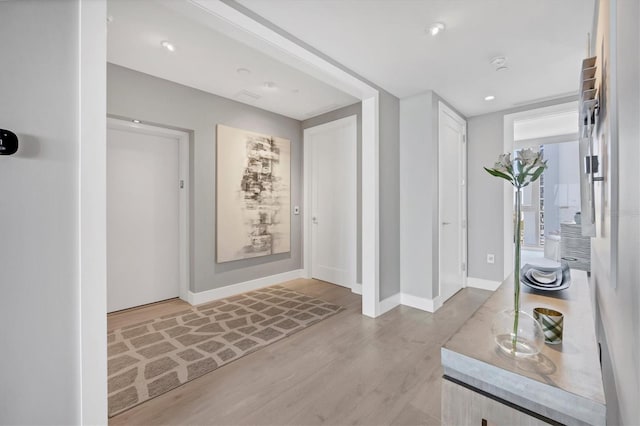 foyer entrance featuring recessed lighting, baseboards, and wood finished floors