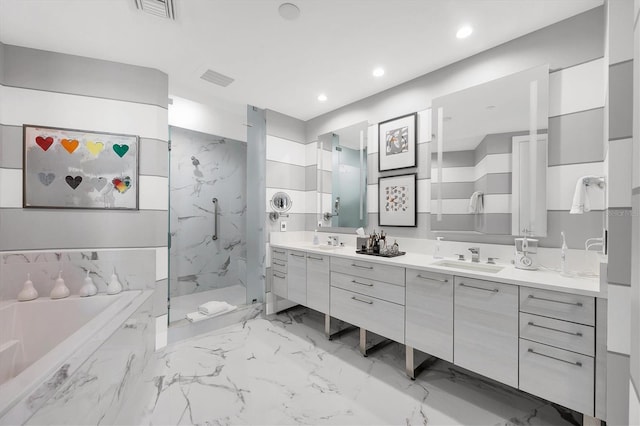 bathroom with a sink, a marble finish shower, a bath, and double vanity