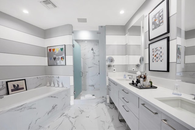 full bath with visible vents, a marble finish shower, a sink, a garden tub, and marble finish floor