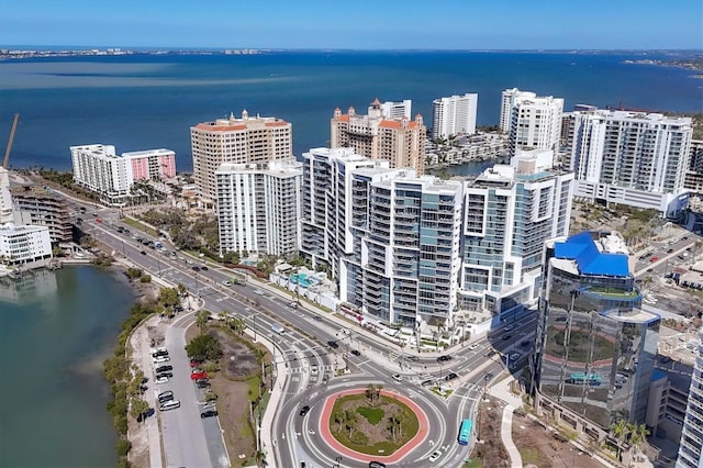 bird's eye view featuring a water view and a city view