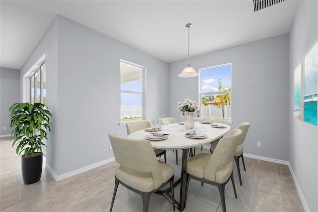 dining room featuring visible vents and baseboards