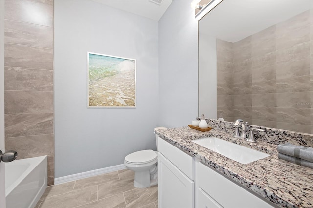 full bathroom with a bath, toilet, vanity, and baseboards