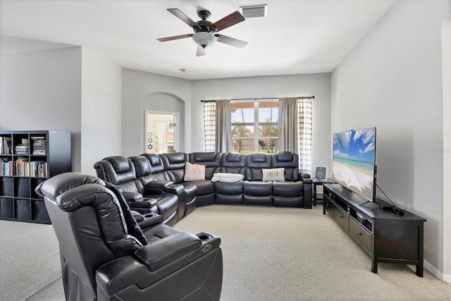 carpeted living area featuring visible vents and ceiling fan