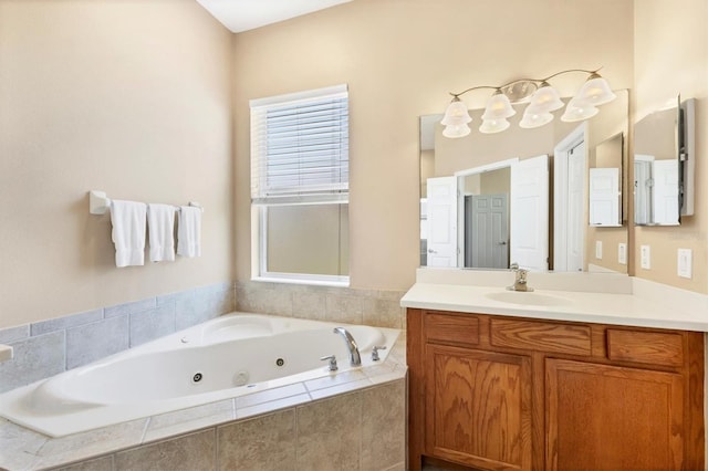 full bathroom featuring vanity and a whirlpool tub