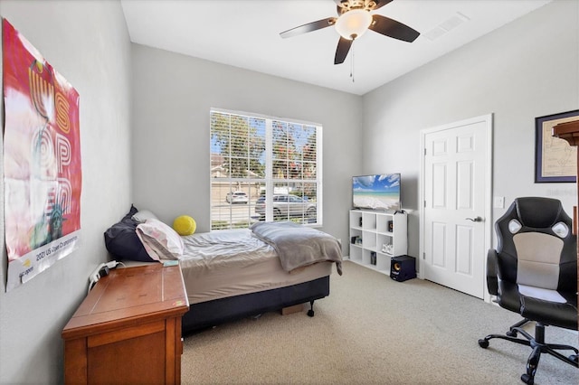 bedroom featuring a ceiling fan, carpet, and visible vents