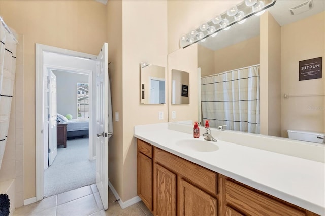 bathroom with tile patterned floors, visible vents, a shower with shower curtain, and vanity