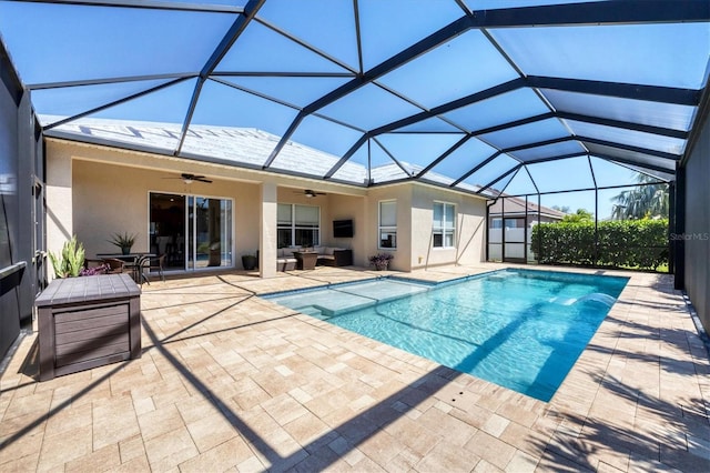 view of pool featuring a ceiling fan, glass enclosure, a patio area, and a fenced in pool