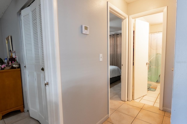 hallway featuring light tile patterned flooring