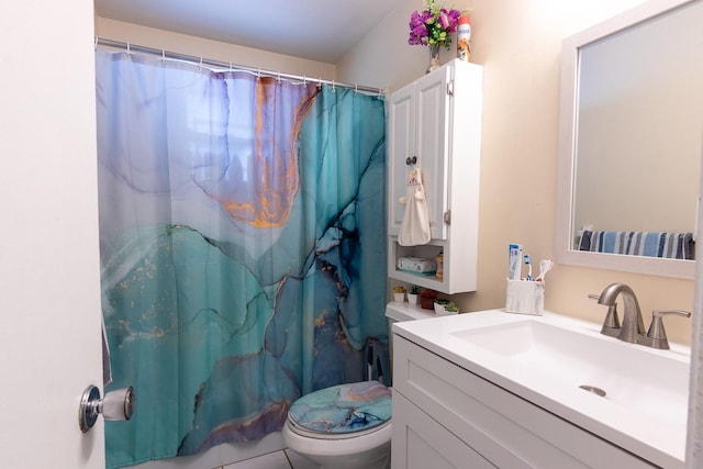 bathroom featuring vanity, a shower with shower curtain, and toilet