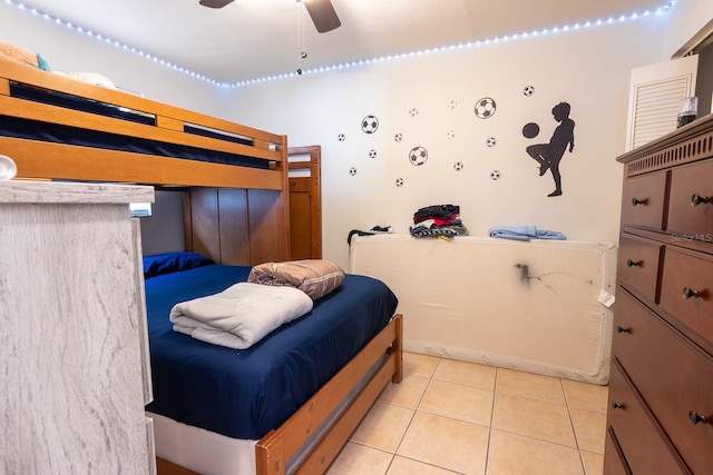 bedroom with light tile patterned flooring and a ceiling fan