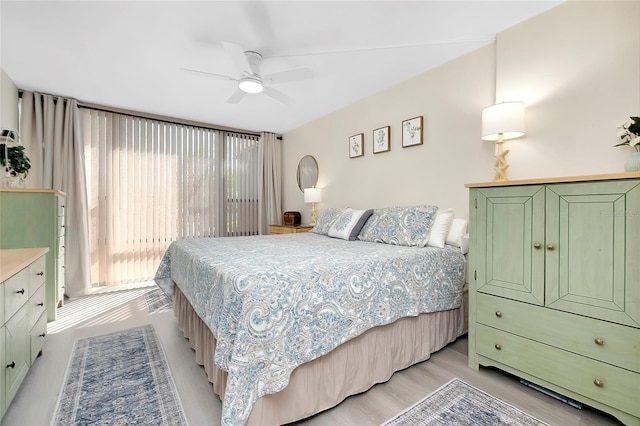 bedroom with a ceiling fan and light wood finished floors