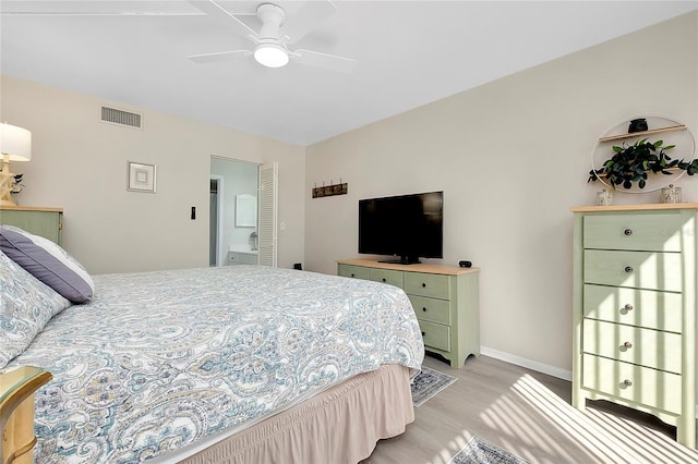 bedroom with visible vents, baseboards, a ceiling fan, and light wood finished floors