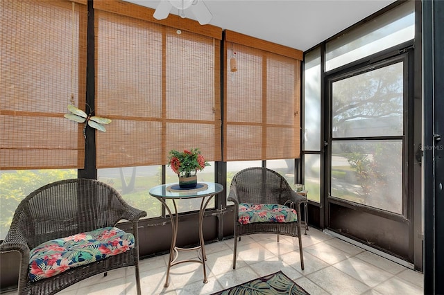 sunroom with a ceiling fan