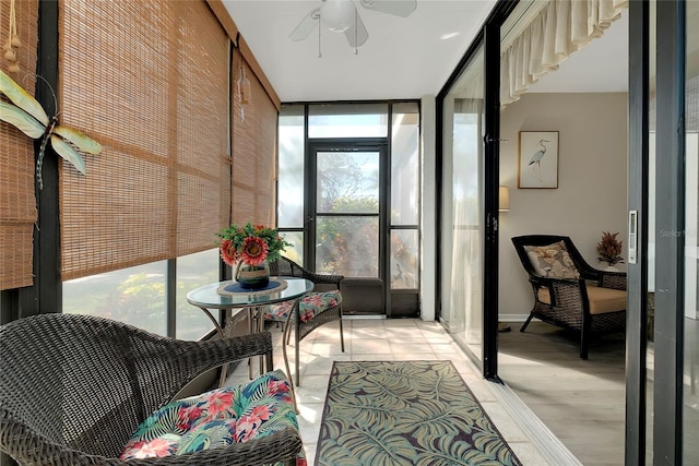 sunroom with a ceiling fan