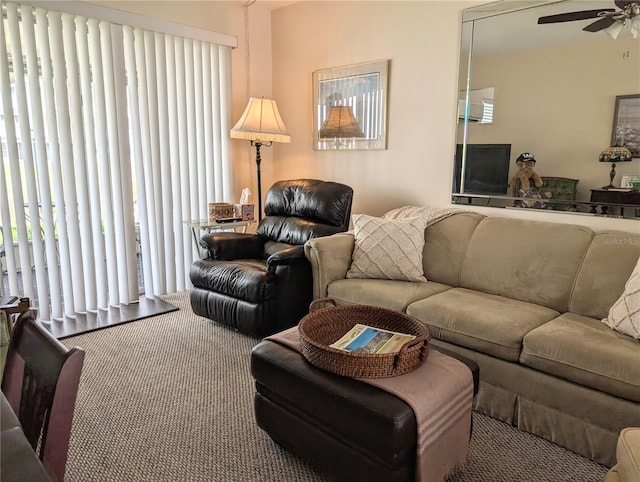 carpeted living room featuring ceiling fan