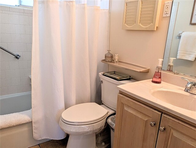 full bath featuring shower / bath combination with curtain, toilet, and vanity