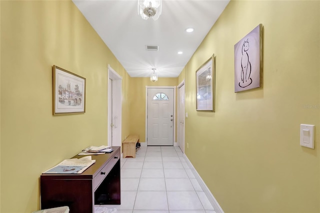 doorway to outside with light tile patterned flooring, visible vents, baseboards, and recessed lighting