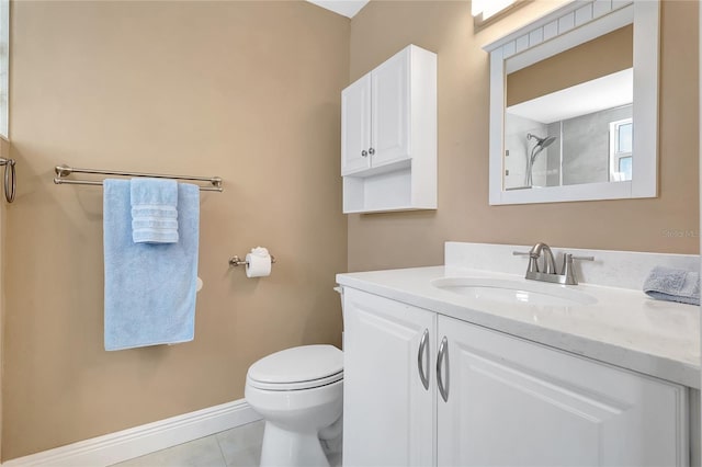 bathroom with tile patterned floors, vanity, walk in shower, baseboards, and toilet