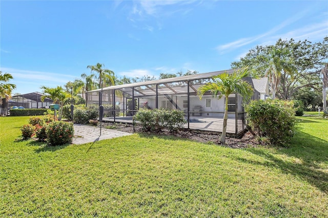 exterior space featuring a lawn, a patio, and a lanai