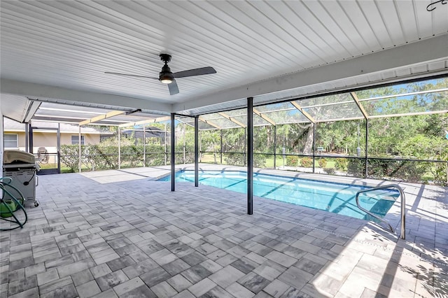 outdoor pool featuring a patio area, a lanai, and ceiling fan
