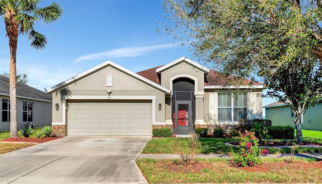 view of front facade featuring stone siding, stucco siding, driveway, and a garage