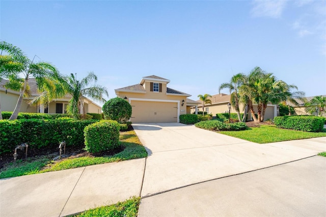 view of front of property with stucco siding, an attached garage, and concrete driveway