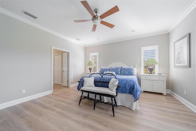 bedroom featuring light wood-style flooring, baseboards, and visible vents