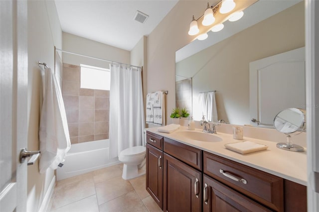 full bath featuring vanity, visible vents, tile patterned flooring, shower / tub combo, and toilet