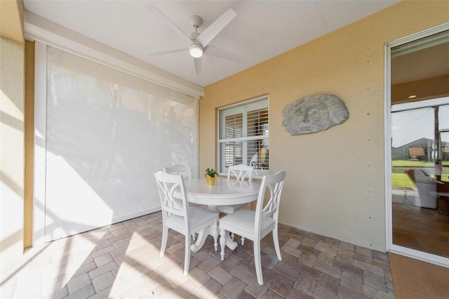 dining space featuring ceiling fan