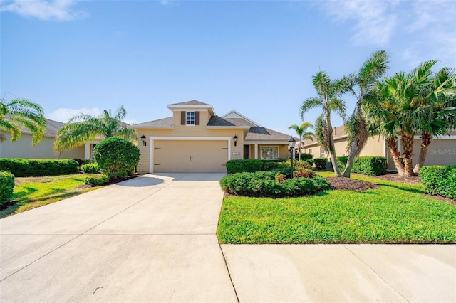 view of front of house featuring stucco siding, a front yard, an attached garage, and driveway