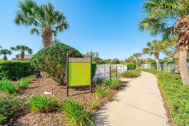 surrounding community with a gate and fence