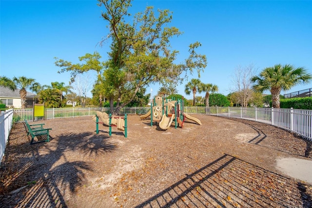 community jungle gym featuring fence