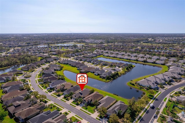 birds eye view of property featuring a residential view and a water view