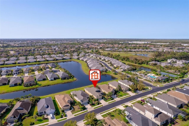 bird's eye view with a residential view and a water view