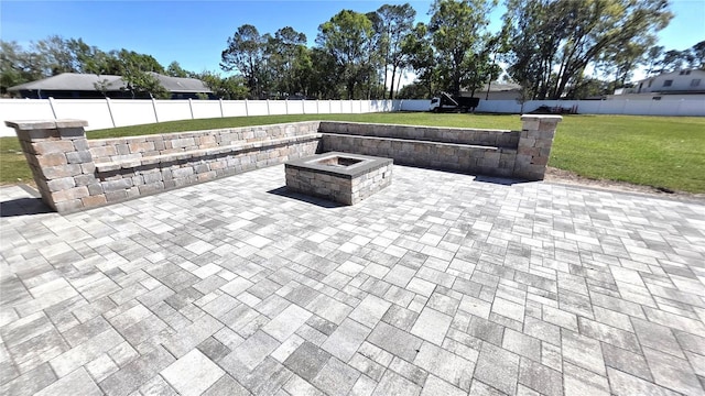 view of patio featuring a fire pit and a fenced backyard