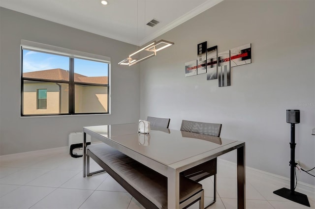 dining space featuring light tile patterned flooring, baseboards, and visible vents