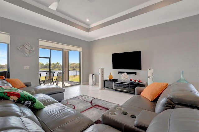 living room featuring recessed lighting, a raised ceiling, light tile patterned flooring, and crown molding