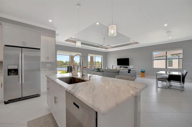 kitchen with dishwashing machine, light tile patterned flooring, a sink, a raised ceiling, and stainless steel fridge