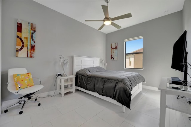 bedroom with light tile patterned flooring, a ceiling fan, and baseboards