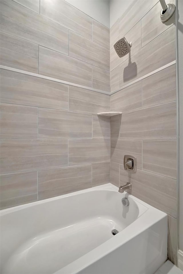 full bath featuring washtub / shower combination