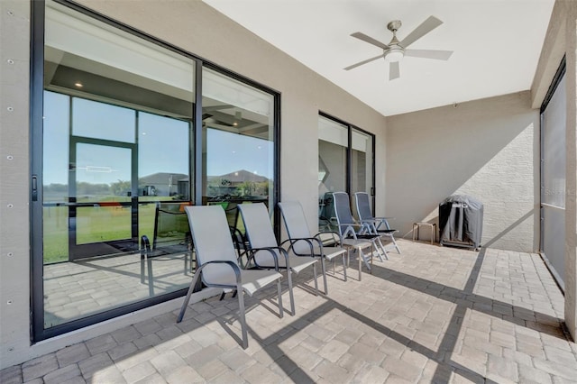 view of patio featuring a ceiling fan