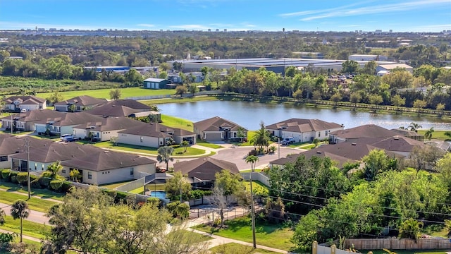 drone / aerial view featuring a residential view and a water view