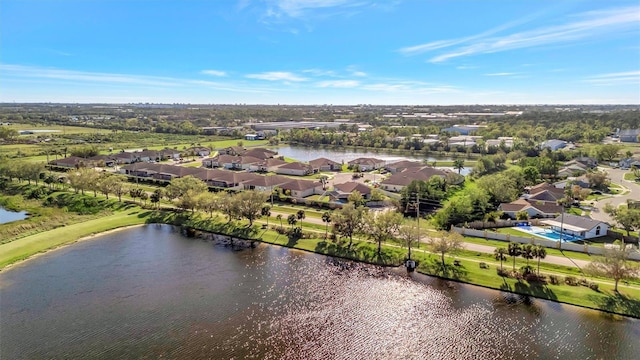 birds eye view of property featuring a residential view and a water view