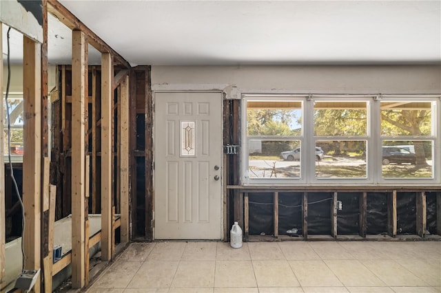 entryway with light tile patterned flooring