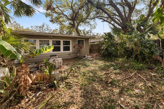 back of property featuring fence