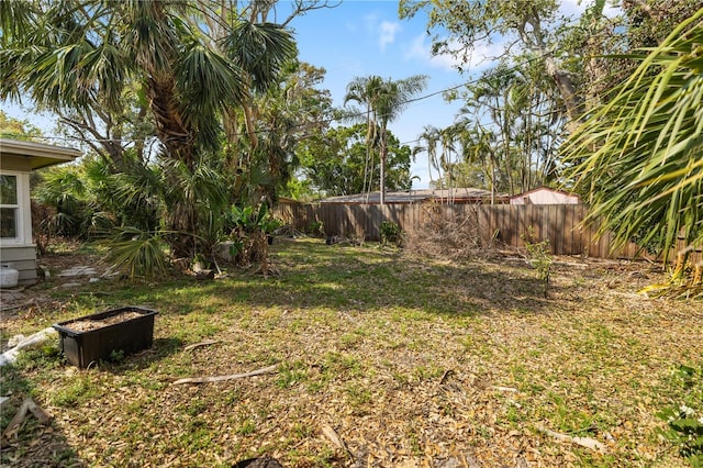 view of yard with a fenced backyard