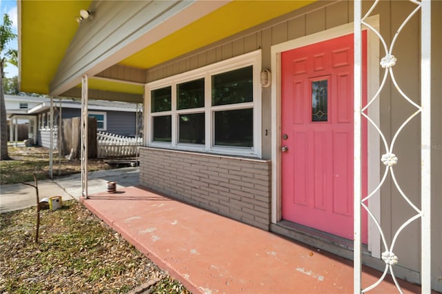 property entrance with brick siding