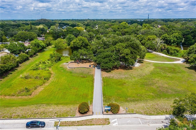 drone / aerial view featuring a forest view