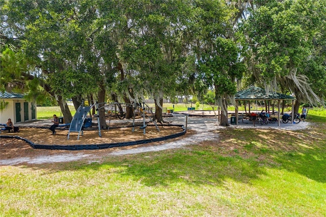 community playground featuring a gazebo and a lawn